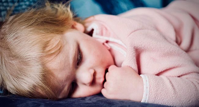 Baby sleeping in a crib