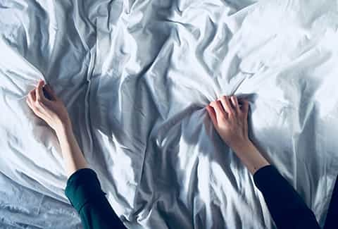 Woman with numb hands after sleeping